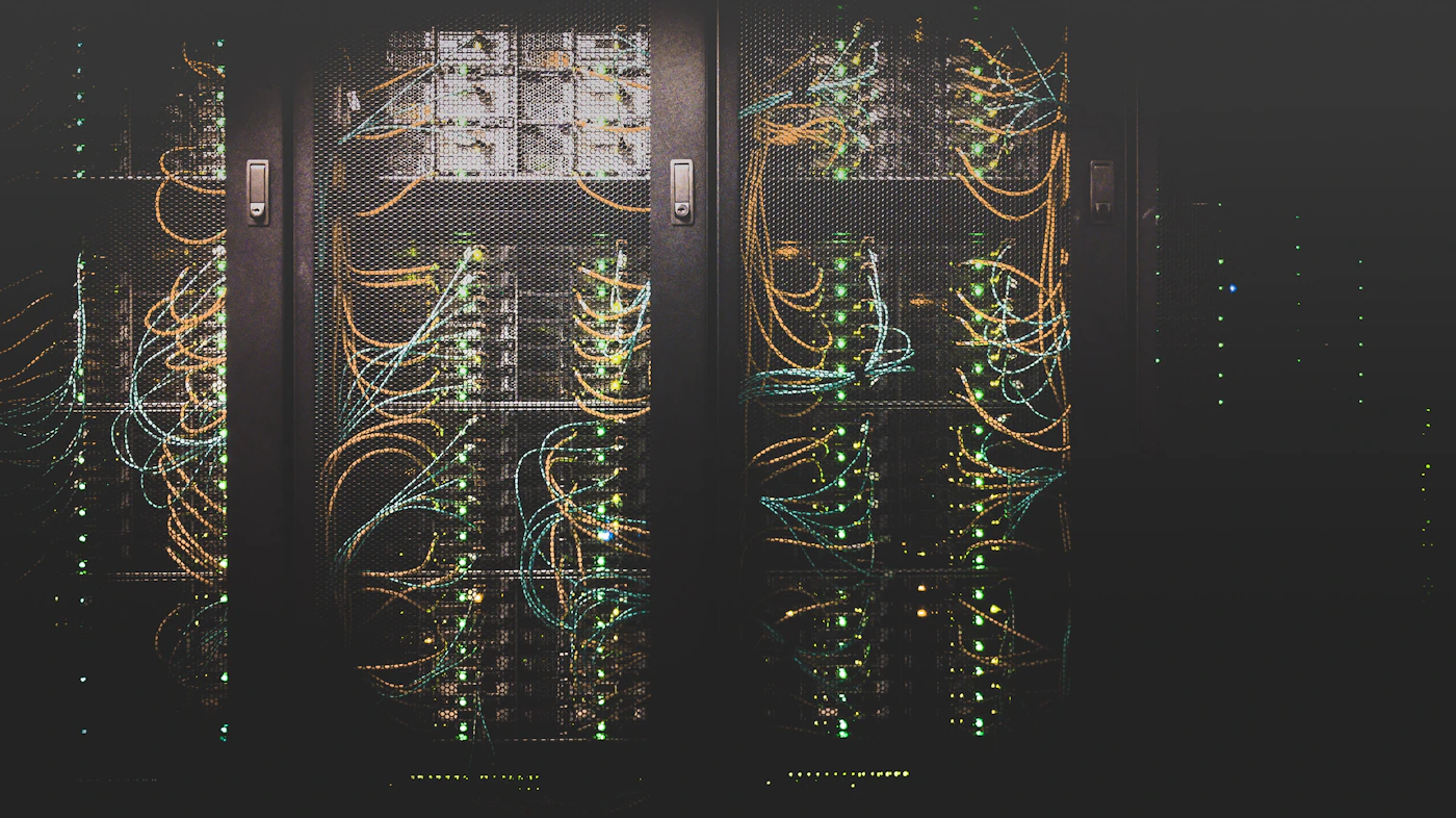 Server room interior with racked equipment, where infrastructure is continuously observed